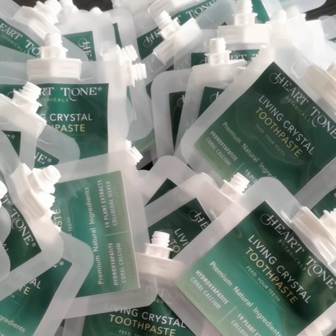 Small translucent printed sample pouches with spouts arranged together